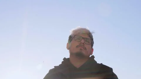 Non-binary style teenager thoughtfully looking at the sky, 4k 스톡 동영상 234569009