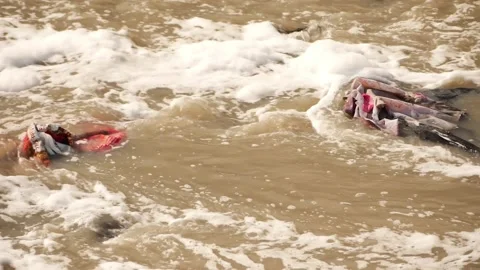 Non biodegradable waste at middle of river, Dirty water flowing in river Video stock 148196429