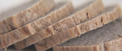 Non-celiac bread slides close-up 4K scope footage Stock Footage 321857462