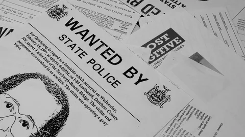NON DESCRIPT WANTED POSTERS DROP INTO FRAME.  4K, 10 BIT CLOSE UP. Video stock 120950970