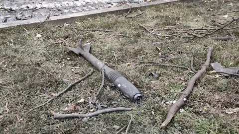 Non detonated missile and burning Ukrainian tank wrecks Stock Footage 186915159