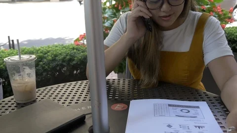 Non Profit Worker at Cafe Looking at Reports Philanthropy Stock Footage 114708302