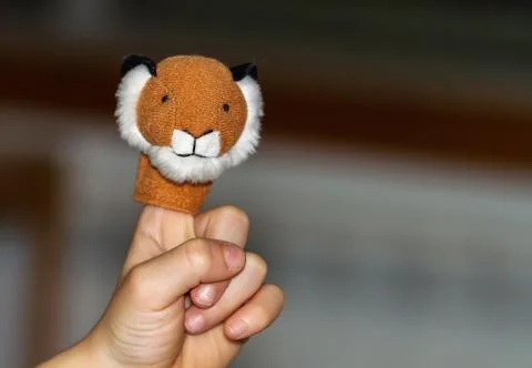 Non-recognizable hand with animal puppet on finger Stock Photos