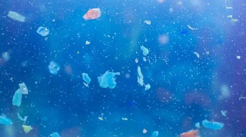 Non-recyclable plastic pollution in the oceans. Selective focus of underwater Stock Photos