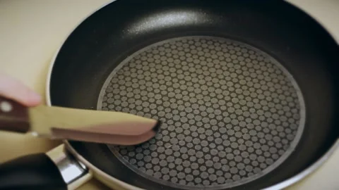 Non-stick coating, how to choose a good pan. The knife scratches the pan. Stock Footage 194400211