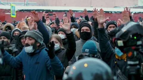 Non-violent protesters showing unarmed hands to riot police line, peaceful rally Stock Footage 171615284