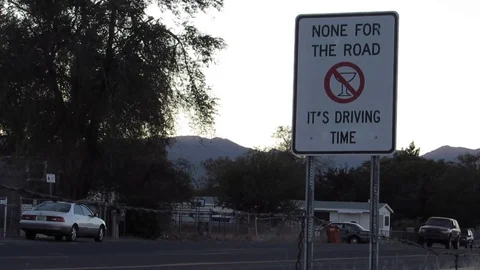 None-for-the-road-its-driving-time-street-sign Stock Footage 80544431