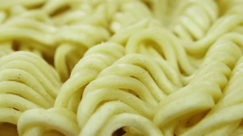 Noodle block ready for cooking slow pan 4K - Instant Chinese type noodles Stock Footage 155277720