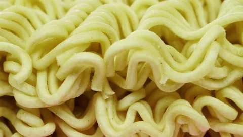 Noodle block ready for cooking slow pan 4K - Instant Chinese type noodles Stock Footage 155281269