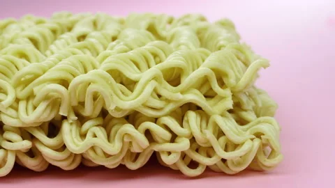 Noodle block ready for cooking slow pan 4K - Instant Chinese type noodles Stock Footage 155283483