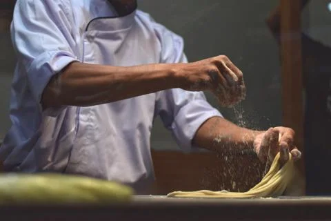 Noodle cooking process in kitchen Stock Photos