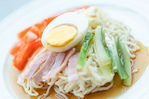 Noodle soup with egg and vegetable topping Stock Photos
