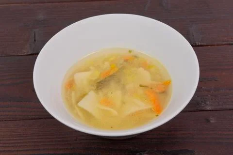 Noodle soup with vegetables on a table Stock-Fotos