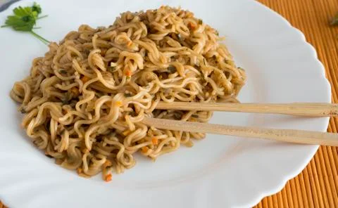 Noodles with beef in rectangle plate with bamboo stic Stock Photos