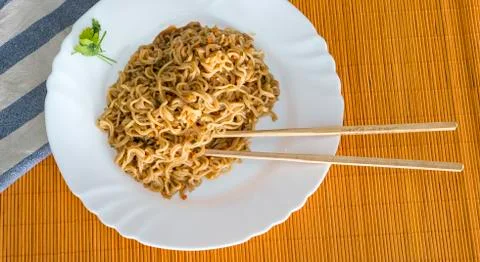 Noodles with beef in rectangle plate with bamboo stic Stock Photos