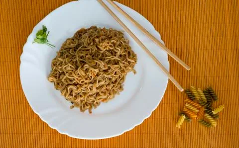 Noodles with beef in rectangle plate with bamboo stic Stock Photos