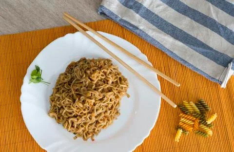 Noodles with beef in rectangle plate with bamboo stic Stock Photos