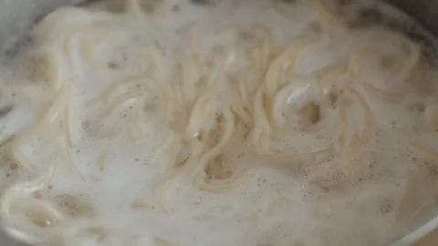Noodles in boiling water Stock Footage 90627633