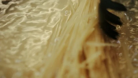 Noodles in a boiling water Stock Footage 98361352
