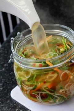 Noodles in broth Stock Photos