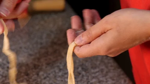 Noodles intertwined by hand Stock Footage 97952383