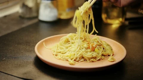 Noodles on plate Stock Footage 98361733