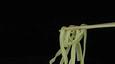 Noodles rotates on a black background Stock Footage 35006161