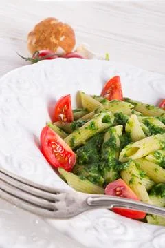 Noodles with spinach Stock Photos