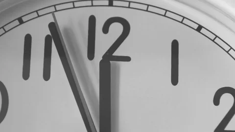Noon on mechanical clock black and white Stock Footage 82369248
