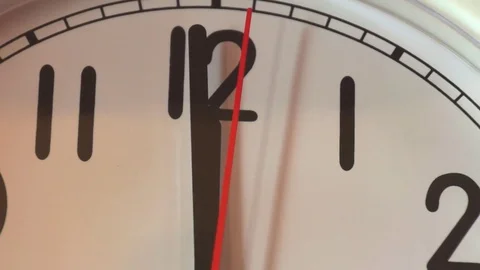 Noon on a mechanical clock close up Stock Footage 82369159