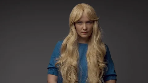 Nordic blond model in studio with dramatic top light. Blonde long hair Stock Footage 108614353