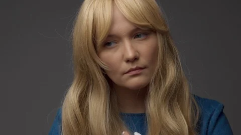 Nordic blond model in studio with dramatic top light. Blonde long hair Video stock 108614758