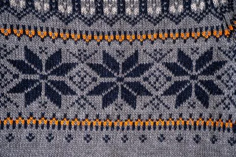 Nordic Knit Pattern Background. Texture Christmas grey sweater. Stock Photos