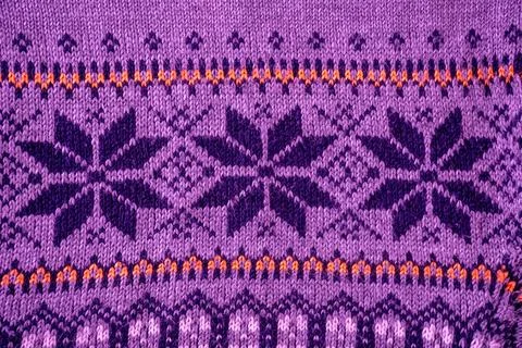 Nordic Knit Pattern Background. Texture Christmas sweater. Purple color Stock Photos