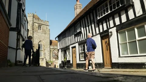 A nordic pole walker passes housing in Hastings UK 6K Stock Footage 329901387