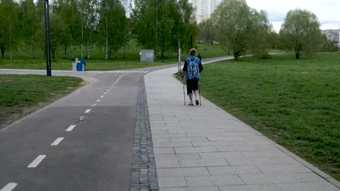 Nordic walking in the park 库存影片 240434673