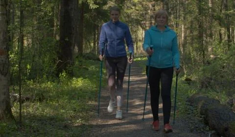 Nordic walking in spring forest Stock Photos