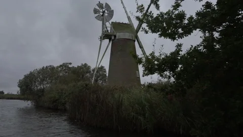 Norfolk Broads with windmill and boating holidays in England UK 4K Stock Footage 170108151