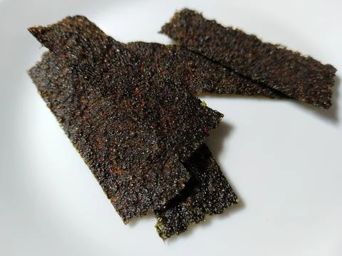 Nori is dried seaweed processed into thin sheets. It comes in a spicy flavor  Фото