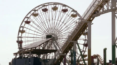 Noria and roller coaster working at the same time Stock-Footage 36578564