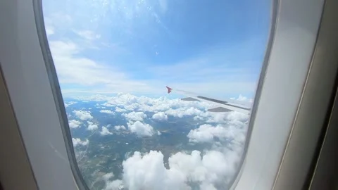 Normal airplane window seat view on a beautiful land nature Stock Footage 293778005