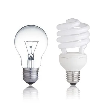 Normal and saver lightbulb with reflection Stock Photos