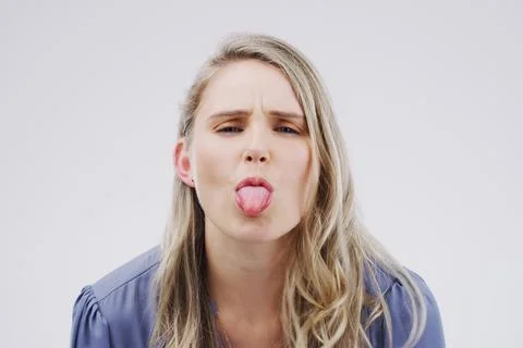 Normal is for boring people. Studio shot of a young woman making a funny face Stock Photos