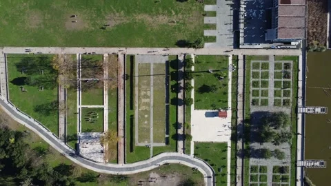Normal life routine in city park with running, socialising, green area and lake. Stock Footage 166474858