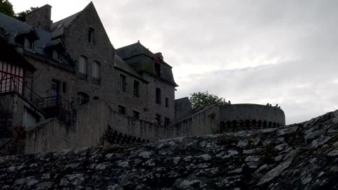 Normandy, 08-24-2024. Typical medieval houses inside walls of Mont Saint Michel. Video stock 327135916