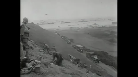 NORMANDY - 1944 - M3 half-track and armored cars move out of landing craft on Stock Footage 340658239