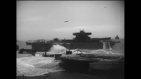 NORMANDY - 1944 - Ocean surf breaks over concrete block ships and scuttled Stock Footage 254200798