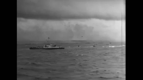 NORMANDY - 1944 - A wounded soldier is given first aid on a landing craft deck, Stock Footage 312684775