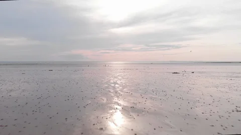 Normandy beach at Sunset, pink sky and reflections on the wet sand. Stock Footage 116185184
