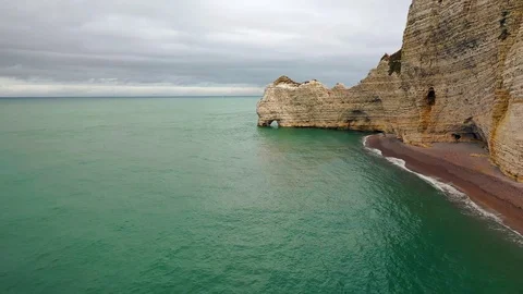 Normandy Etretat beach below the cliffs aerial drone Video stock 95065083